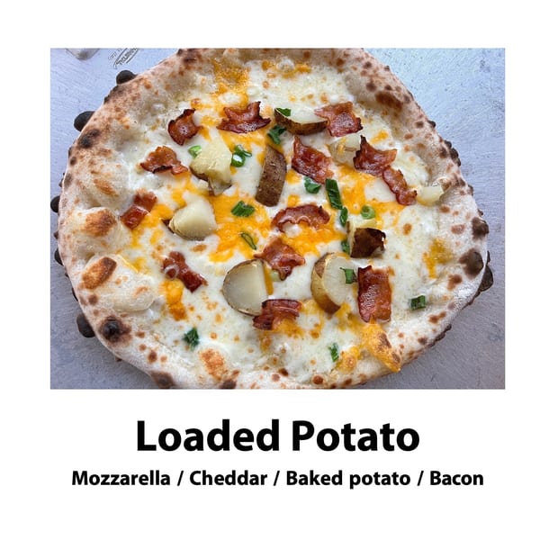 Big Oven Pizza's Loaded Potato pizza, topped with mozzarella, cheddar, baked potato, and bacon.