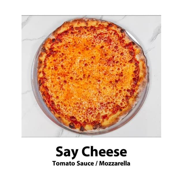 A whole cheese pizza with tomato sauce and mozzarella on a metal pan, on a white marble surface.